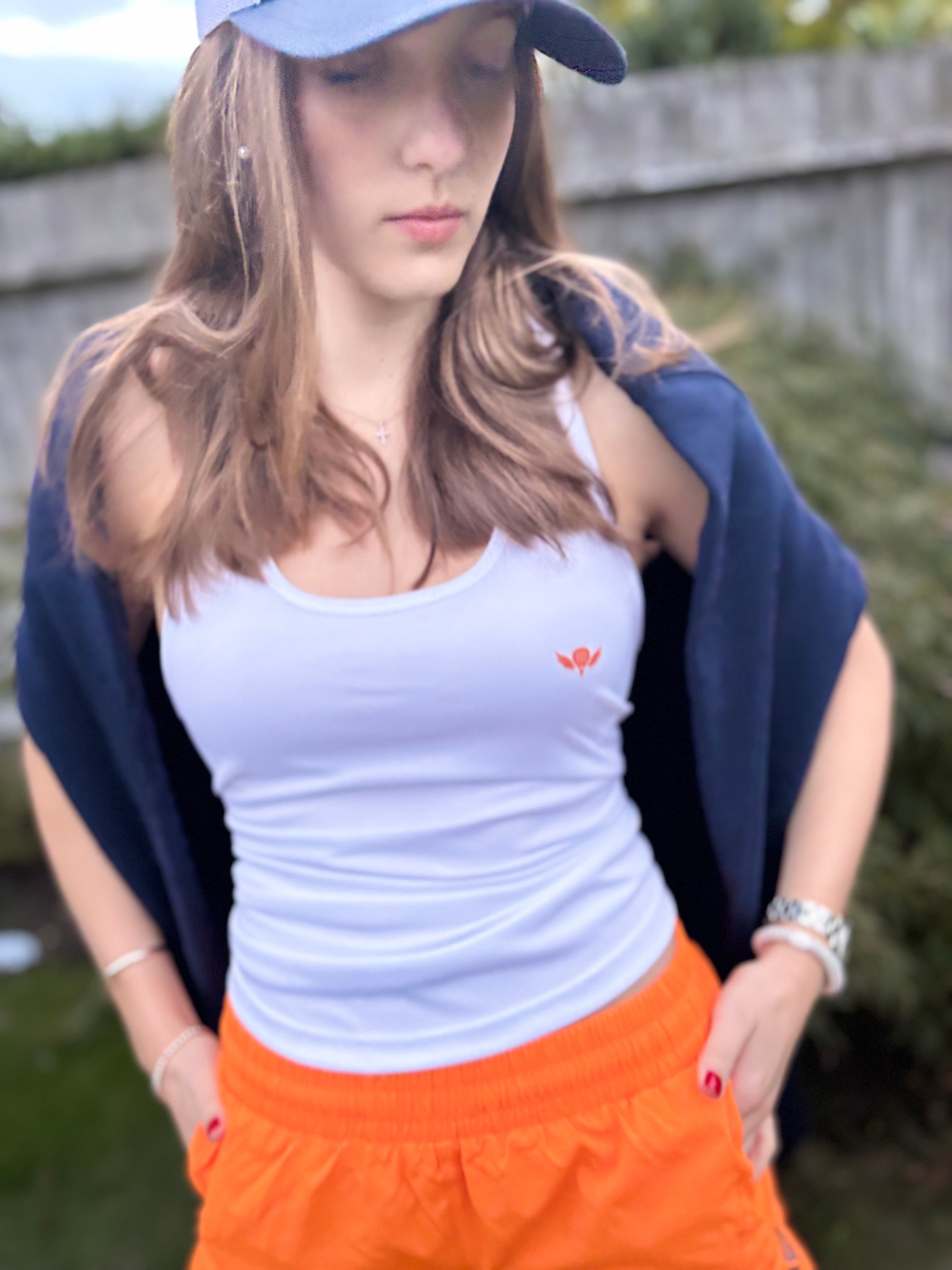 Sliding to Orange – Performance Padel and Pilates Vest
