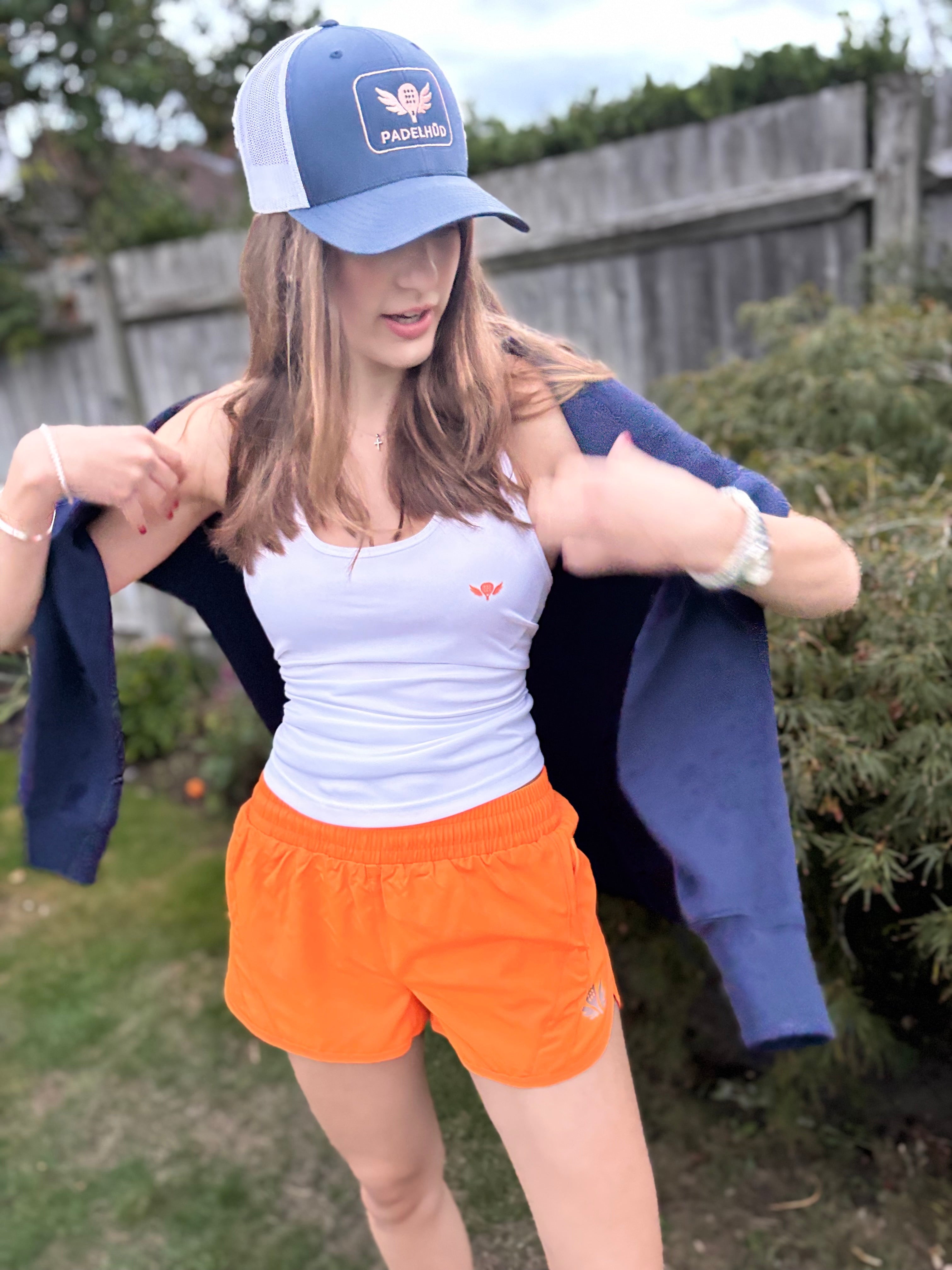 Sliding to Orange – Performance Padel and Pilates Vest