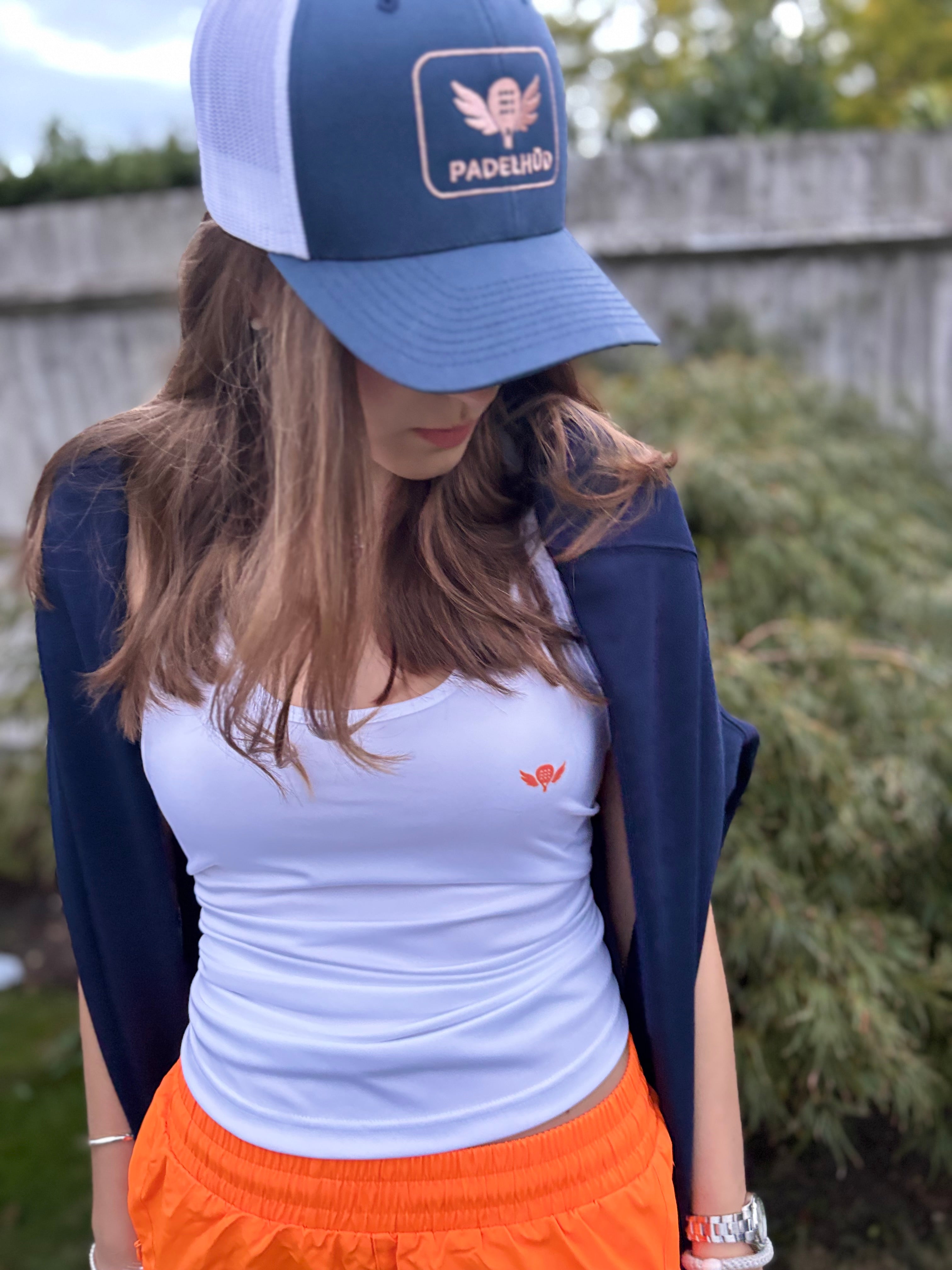 Sliding to Orange – Performance Padel and Pilates Vest